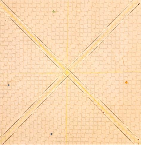Sew the diagonal lines on either side of the chalk line.