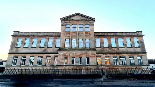 A late Victorian Greek Revival school building.