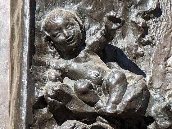 a baby reaches out