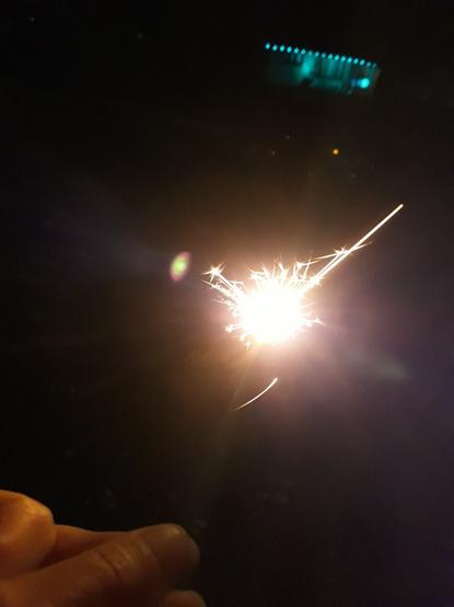 I took a bad picture with my phone in the dark while doing sparklers tonight. It's a light blob. Out of focus. And somehow my phone case is in the picture. I cannot teach you to take photos this bad. You have to be born with this.