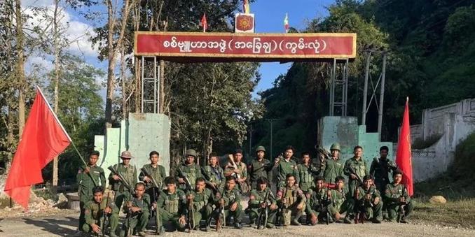 Brotherhood Alliance fighters are seen at the entrance of a regime army base in Kunlong on Nov. 12, 2023. / MNDAA