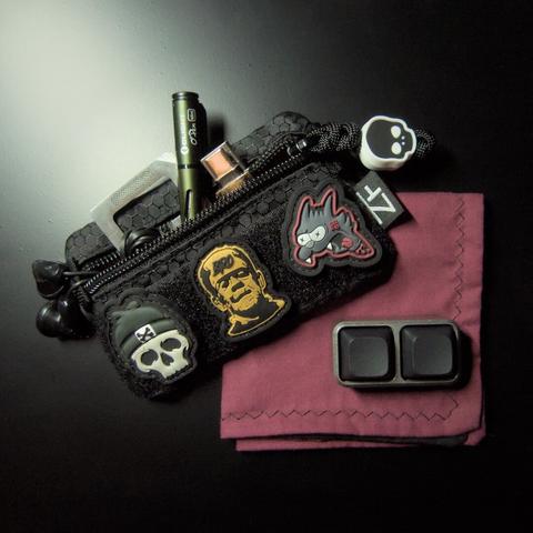 today's EDC pouch showing some (more) horror themed patches, along with a hank made by yours truly