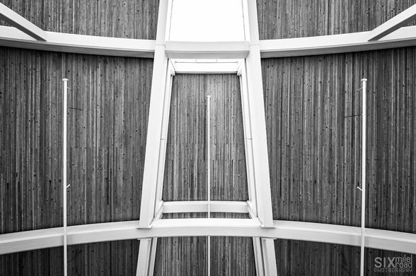A steel structure supporting a wood roof.