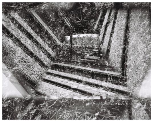 Abstract photograph of railway lines. The image has been fractured caused by reflection of the image inside the Vortoscope, three mirrors clamped together in a triangular formation.