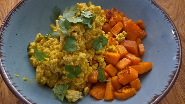 A bowl of scrambled tofu and sweet potatoes for some vegan protein as a post-workout meal/breakfast