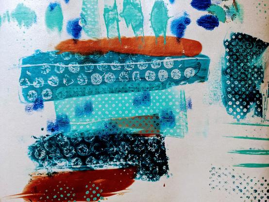 Abstract gel plate print, random smears of paint in teal, blue and copper with textures including dots and bubble wrap.