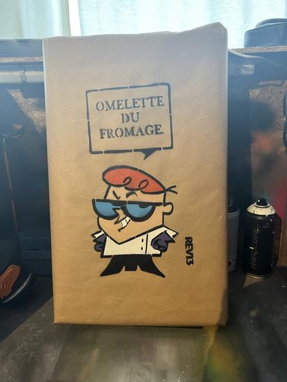 Graffiti stencil of Dexter from Dexters Laboratory saying ‘Omelette Du Fromage’