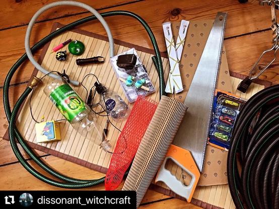 A wooden floor with sound stuff, for eg a saw, cardboard roll, a plastic bottle, a hose with a trumpet mouthpiece