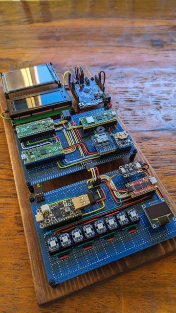 Computer components arranged on a wooden plank.
