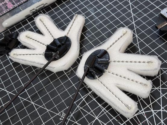 Puppet hands being built showing the internal armature structure.