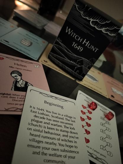 Selection of cards from the game Witch Hunt 1649, including illustrated character card and a story card setting the scene of circa 1649 East Lothian, Scotland.