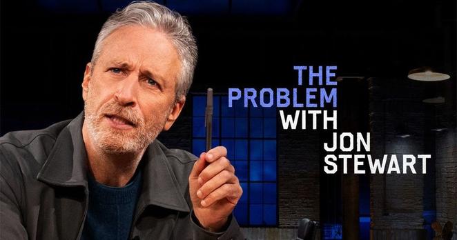 A promotional image for The Problem with Jon Stewart featuring Jon Stewart holding a pen on the left side of the image.
