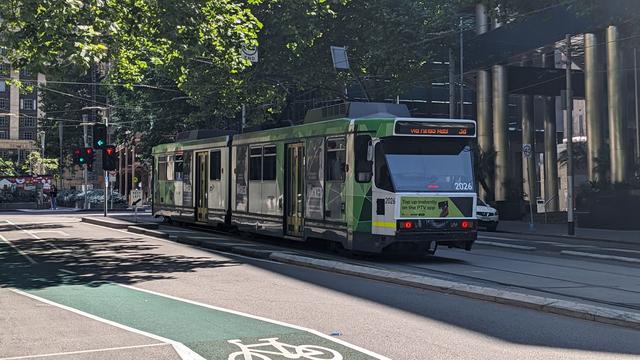 Photo of a B2-class tram number 2026 running north along Market Street in Melbourne with "3a via Kings Way" on the destination display.
