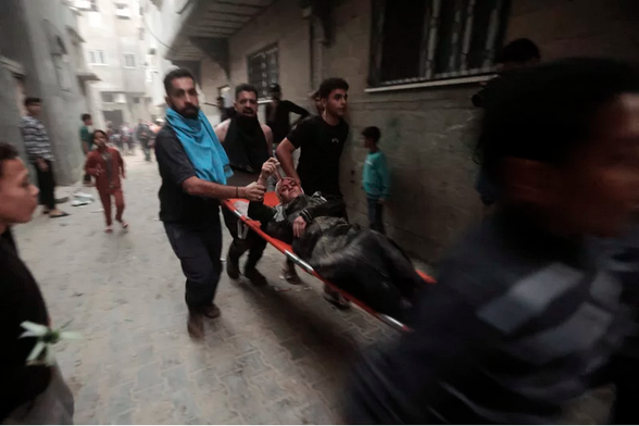 Palestinians evacuate a wounded woman following an Israeli airstrike in Khan Younis refugee camp, southern Gaza Strip, Nov. 13.
Photo: Mohammed Dahman/AP