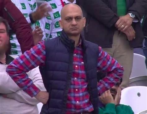 The famous disappointed cricket fan photo - a Pakistani fan stares with his hands on his hips.