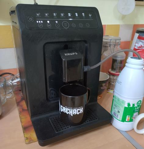 C8H1ON402 being infused with grehack11 edition magic. 
Or the plain version, coffee machine making a nice strong milk coffee in my new grehack mug.