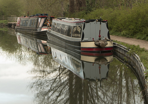 A photo titled "Reflections of Narrowboats", taken near Slipway, Newbury Boat Co by barryskeates on Flickr.
