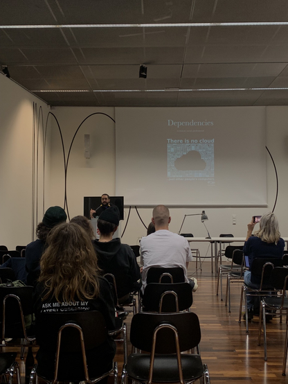 The artist onur olgac is talking in the symposium about emancipation of designers