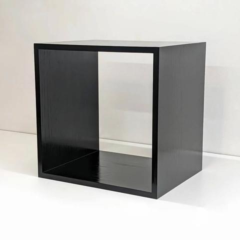 A stained black box with no back at a 45 degree angle.