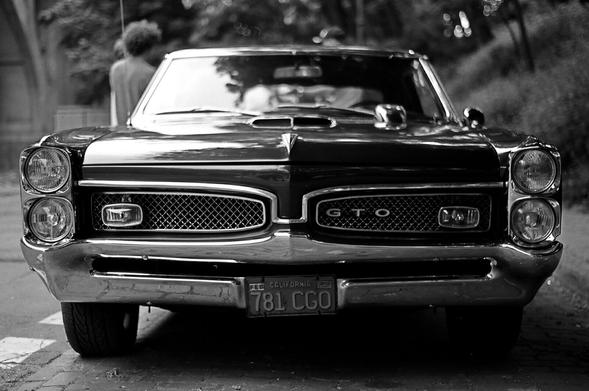 Black and white photo of a vintage American car