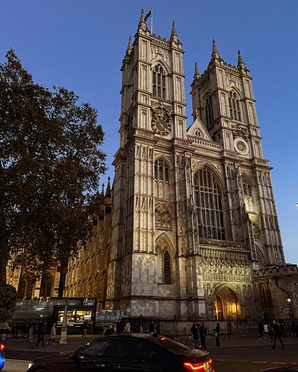 Westminster Abbey bathed in light from the setting sun.