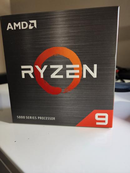 Photo shows box of amd ryzen 5900x cpu.
