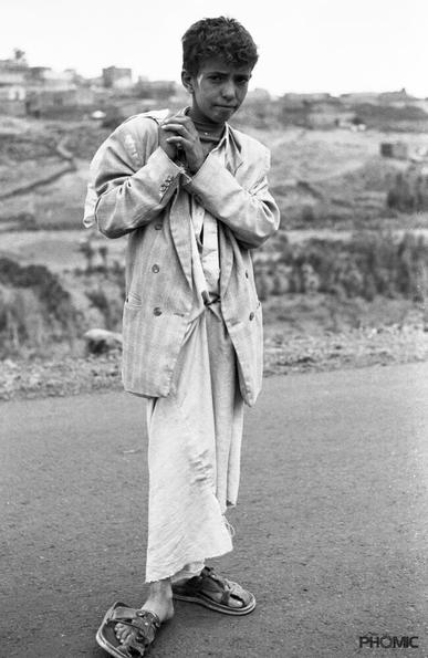 Boy carrying a bag with the drug Khat in the the Hadramaut region in Yemen.