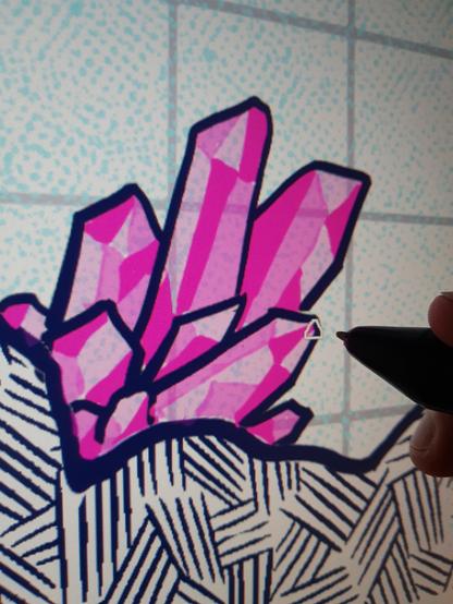 A picture of a drawing monitor screen with crosshashed blue linework and pink crystals. Each crystal is being colored by hand in three tones of pink