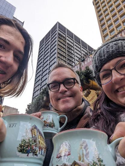 Our teen, me, and Matilda sipping gluhwein (and kinderpunsch) at Christkindlmarket Chicago. We have cute little mugs.