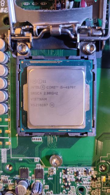 Close-up of the processor socket on the M93p's motherboard, with the i5-4570T in place. The CPU bracket has been lifted.