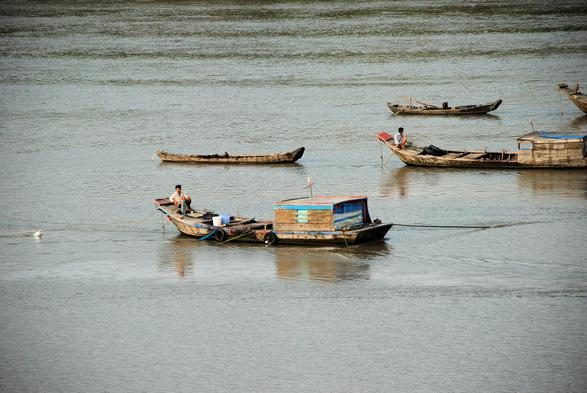 Workboats in Saigon river.