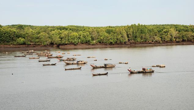 Workboats in Saigon river.