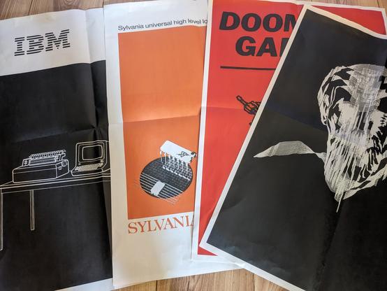 Three newspaper sized prints lying on the floor because I don't have frames yet