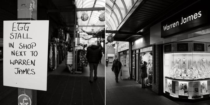 A monochrome diptych. The picture on the left shows a sign in the foreground reading “Egg stall in shop next to Warren James”, with the background dark and out of focus. The picture on the right shows part of the jewellery shop Warren James, and the adjacent shop, with a person looking in the window.