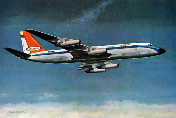 A speed jetliner with 4 jets is flying through some dark skies.