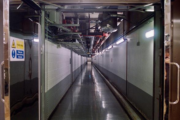 A colour photograph of a behind the scenes corridor at Canary Wharf.