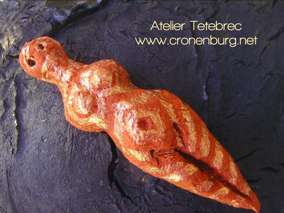 Reclining female torso in ochre with gold painting, inspired by statuettes from the European Cucuteni culture, 4500 BCE. I find the ochre on one of our mountains as rocks and grind the stones to pigment by hand.