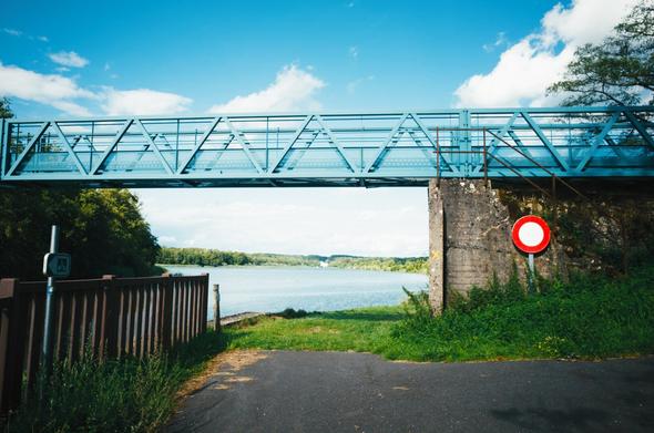 A picture of a bridge crossing a river.