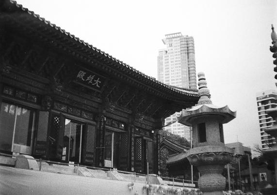 Daeungjeon(Main Building of Buddhism Temple) and Modern Skyscraper