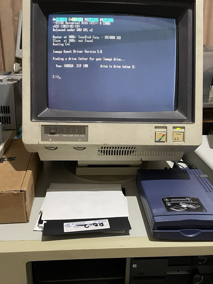 Old ibm computer with 5.25 inch floppy disks and a blue zip drive