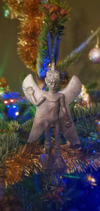 An image of Pazuzu hanging from a Christmas Tree
