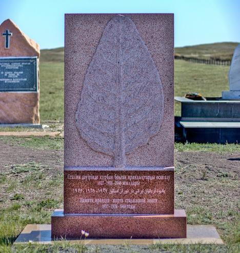 Memeorial stones set in the Kazakh steppe to commemorate the dead