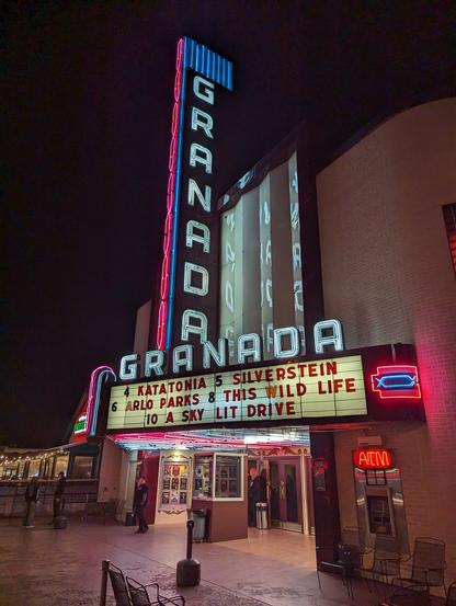 Outside of the venue, Granada theater with old school signage showing Katatonia, Silverstein and other bands playing there