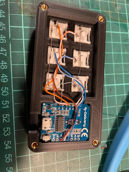 backside of the macropad with mcu and switches wired up.