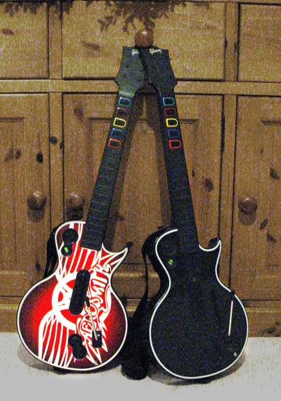 A poor quality photo of Guitar Hero guitars taken on an ancient camera