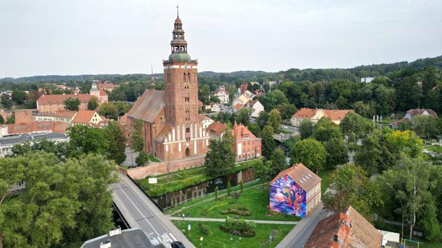 Mural by Wakeuptime in Lidzbark Warmiński (Poland) dedicated to Nicolaus Copernicus, a Polish astronomer, who formulated a model of the universe that placed the Sun rather than Earth at its center