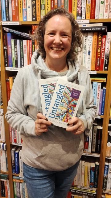 author Kirsty Maynor with her self help book Untangled, in the Edinburgh Bookshop