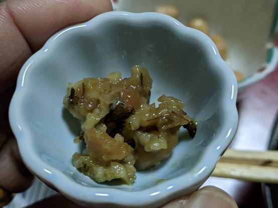 Kinzanji miso - about a teaspoonful in a small round bowl. There are vegetables, cucumbers and also small bits of rice stuck together in the ferment