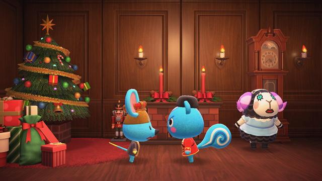 Animal Crossing: New Horizons screenshot. In a wooden panel room with wooden flooring there is a large Christmas tree to the left with a red carpet beneath it and a pile of presents. Immediately to the right of that is a red brick fireplace with two holiday candles lit above it. A large Grandfather clock sits next to it on the right. In front of the Grandfather clock is Muffy dressed in a blue nightgown looking very concerned. In the center are Filbert (right, blue squirrel) dressed as a Nutcracker facing off against Broccolo (blue mouse, left) dressed with a crown and royal garbs.