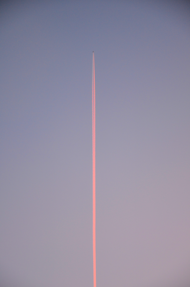 Pinky contrail in the early morning sky